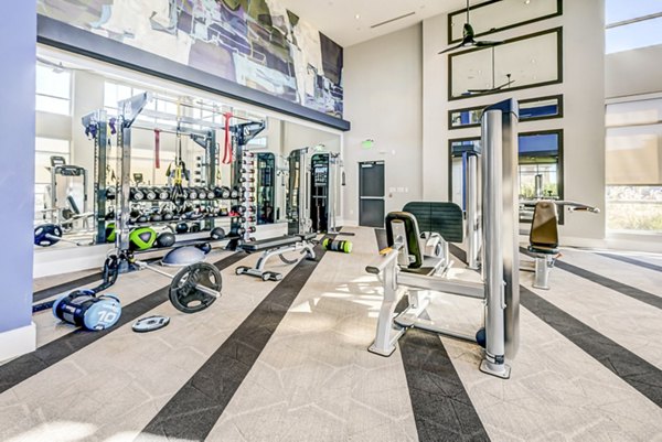 Modern fitness center with state-of-the-art equipment at Encore Motif Apartments, ideal for active lifestyles and wellness-focused residents