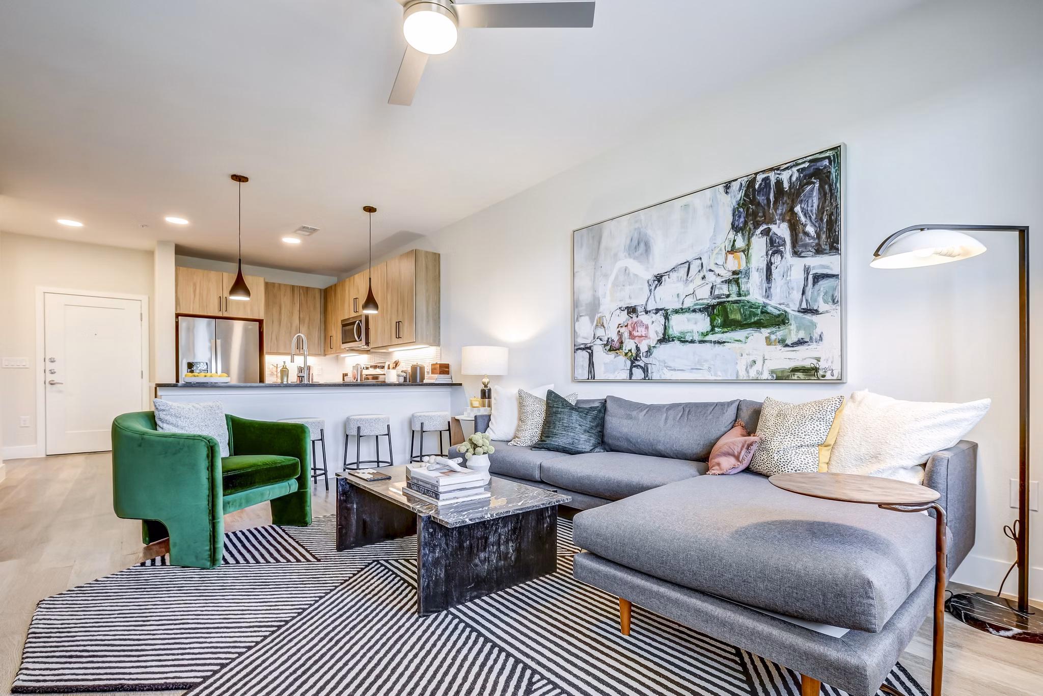 Spacious living room with modern decor in Encore Motif Apartments