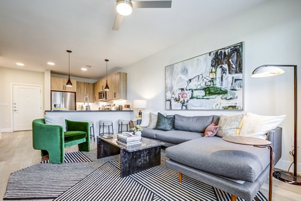Spacious living room with modern decor in Encore Motif Apartments