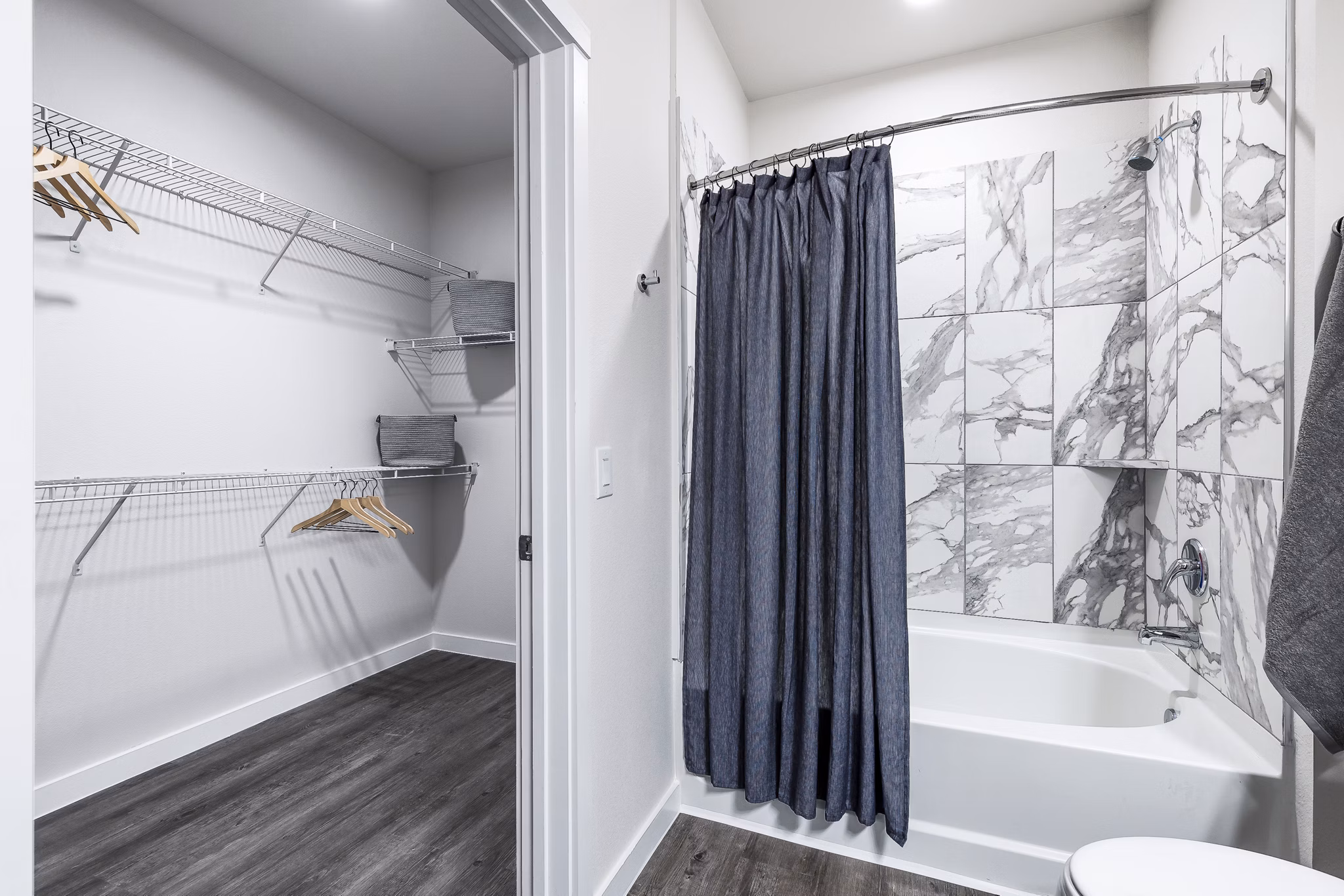 Modern bathroom with elegant vanity and large mirror at Prose Manor Apartments