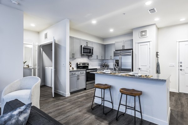 Modern kitchen with stainless steel appliances in Prose Manor Apartments