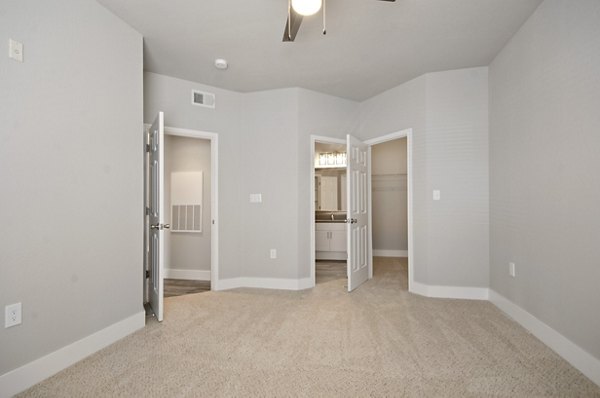 Stylish bedroom with modern decor at Siena Apartments