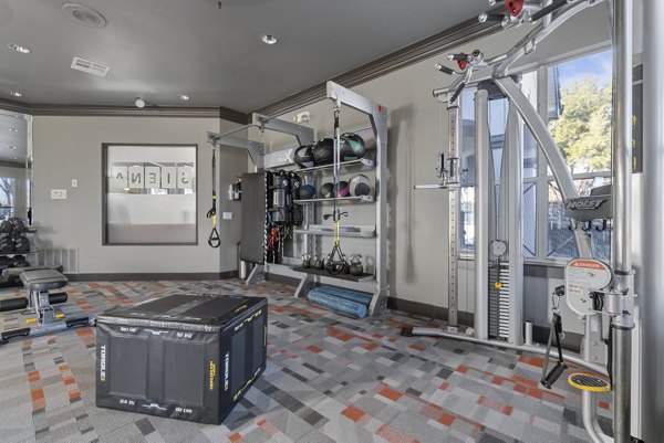 Fitness center with state-of-the-art equipment at Siena Apartments, offering luxury living and wellness facilities for residents