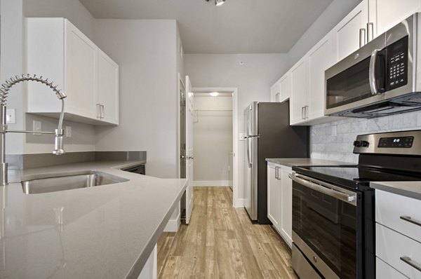 Spacious kitchen with modern appliances in Siena Apartments, a luxury property offering premium living spaces