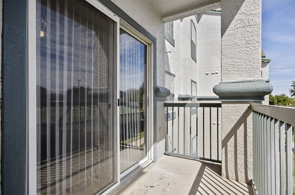 Cozy outdoor patio with seating area at Siena Apartments, ideal for relaxation and social gatherings