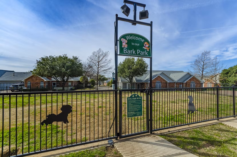 Dog-friendly park area with pet agility equipment at Siena Apartments