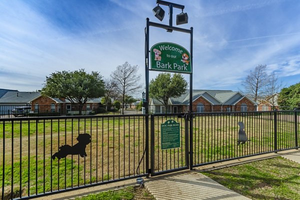 Dog-friendly park area with pet agility equipment at Siena Apartments