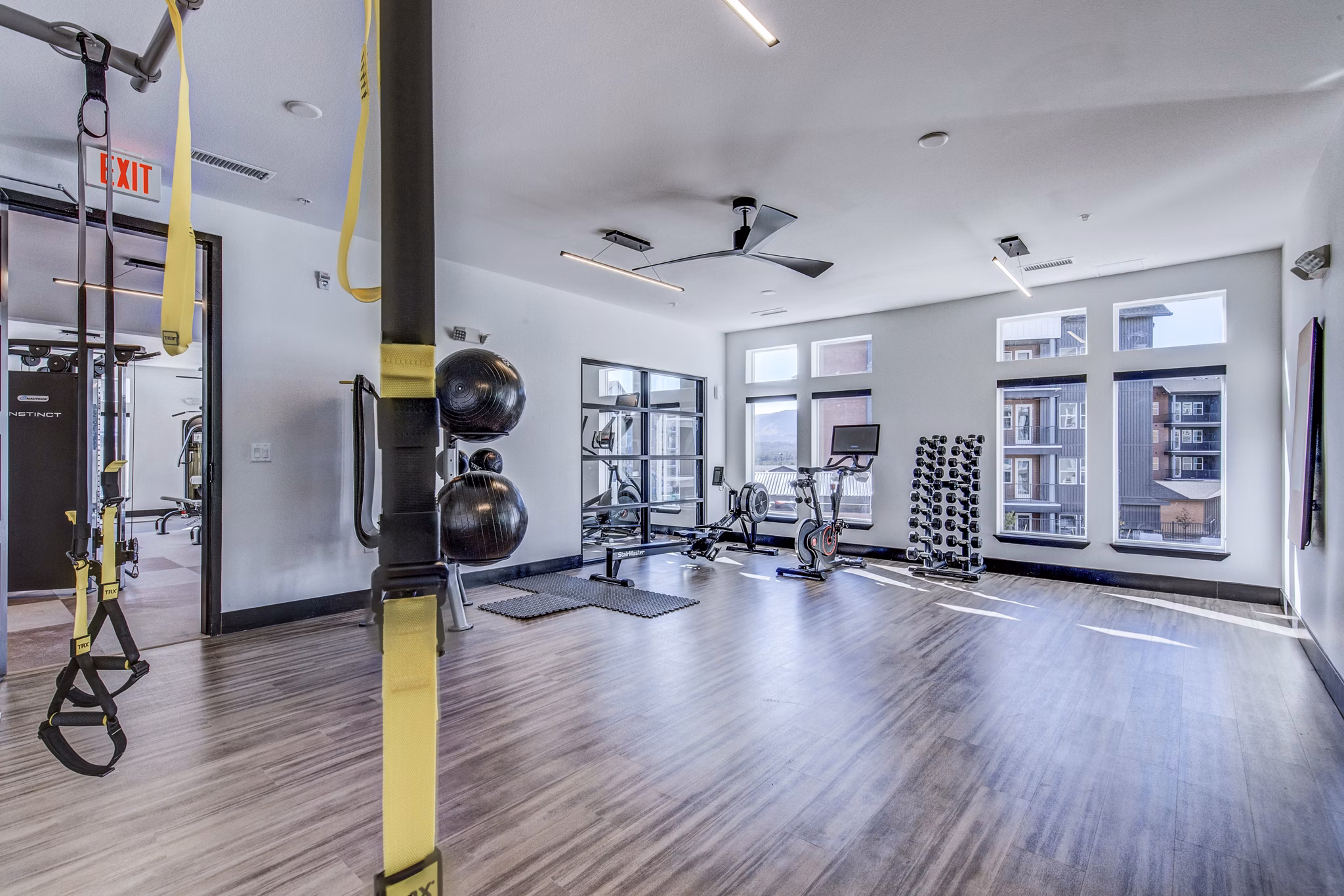 Fully-equipped fitness center at Polaris Junction Apartments with state-of-the-art equipment and spacious workout areas
