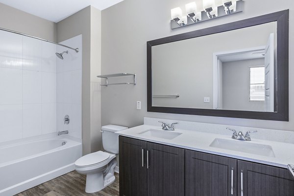 Bathroom with modern fixtures and elegant design at 601 PAX Apartments, a Greystar luxury property