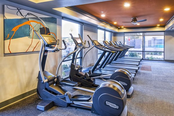 Fully-equipped fitness center with modern machines at 601 PAX Apartments