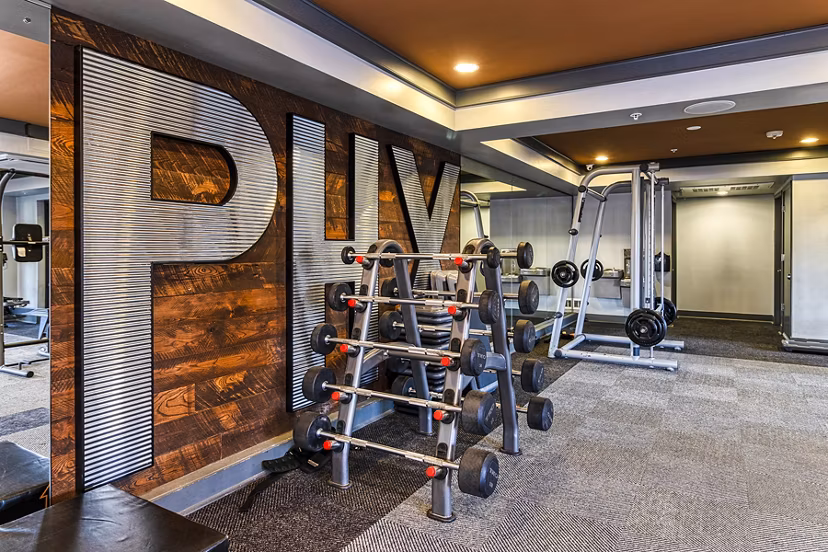 Modern fitness center with state-of-the-art equipment at 601 PAX Apartments