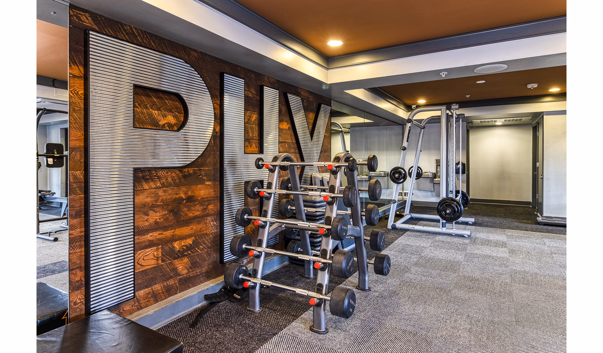 Modern fitness center with state-of-the-art equipment at 601 PAX Apartments