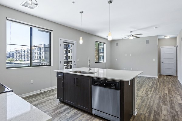 Modern kitchen with stainless steel appliances at 601 PAX Apartments