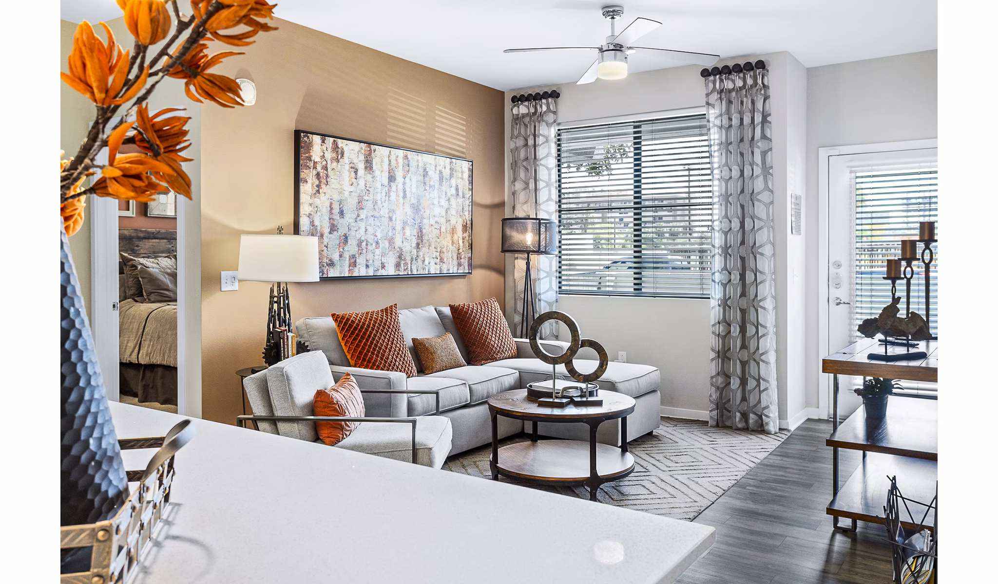 Spacious living room with modern furnishings at 601 PAX Apartments, offering luxury apartment living in vibrant city surroundings
