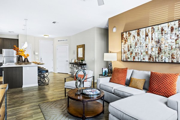 Spacious living room with modern design and natural light in 601 PAX Apartments