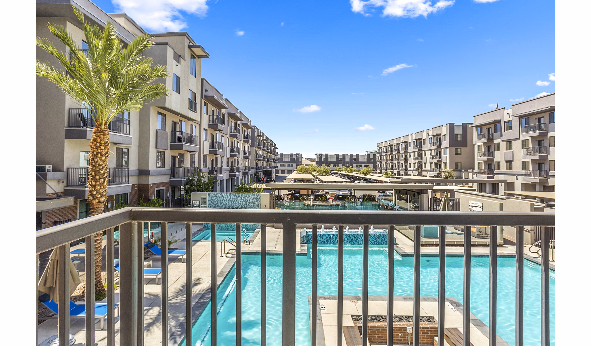 Spacious patio with modern furniture at 601 PAX Apartments offering city views
