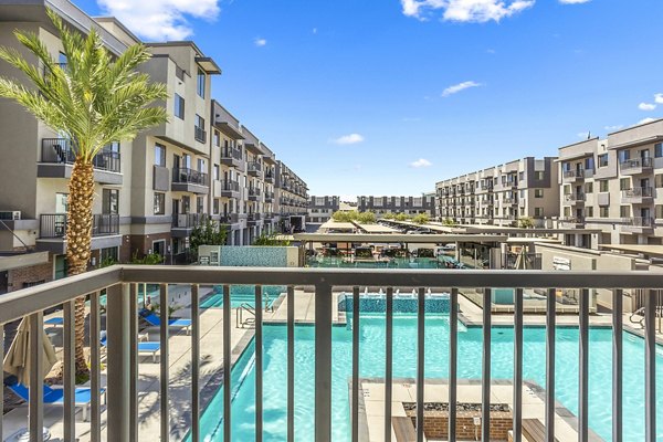 Spacious patio with modern furniture at 601 PAX Apartments offering city views