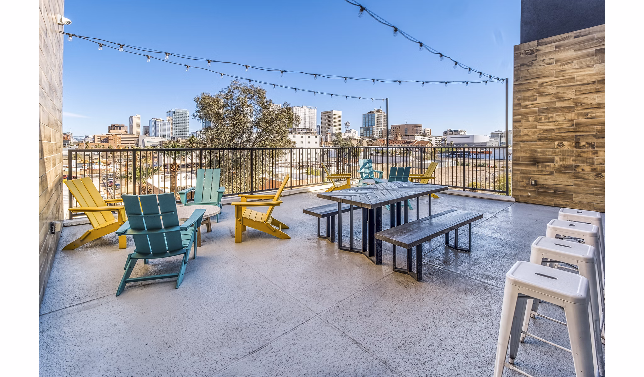 Outdoor patio with modern seating at 601 PAX Apartments clubhouse, ideal for relaxing and socializing in a luxury setting