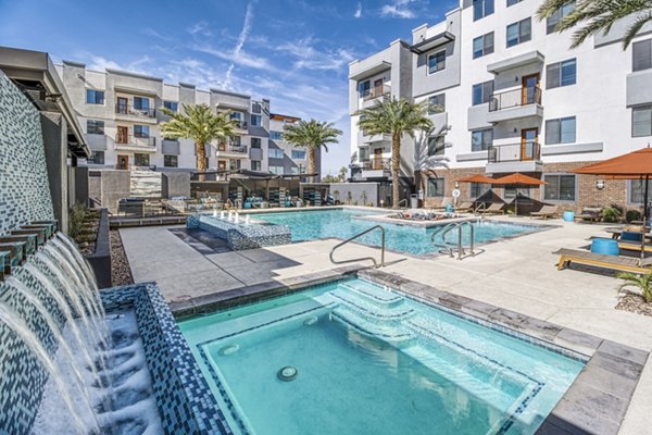 Luxurious outdoor pool at 601 PAX Apartments offering relaxation and stunning views for residents