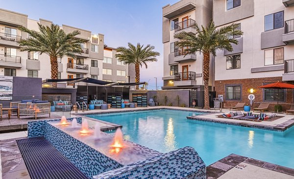 Relaxing pool area with sun loungers at 601 PAX Apartments