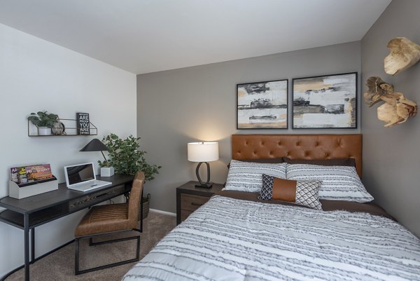 Cozy bedroom with modern decor at Avana Fieldstone Apartments