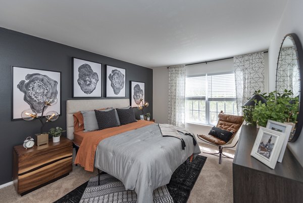 Elegant bedroom featuring modern decor and natural light at Avana Fieldstone Apartments