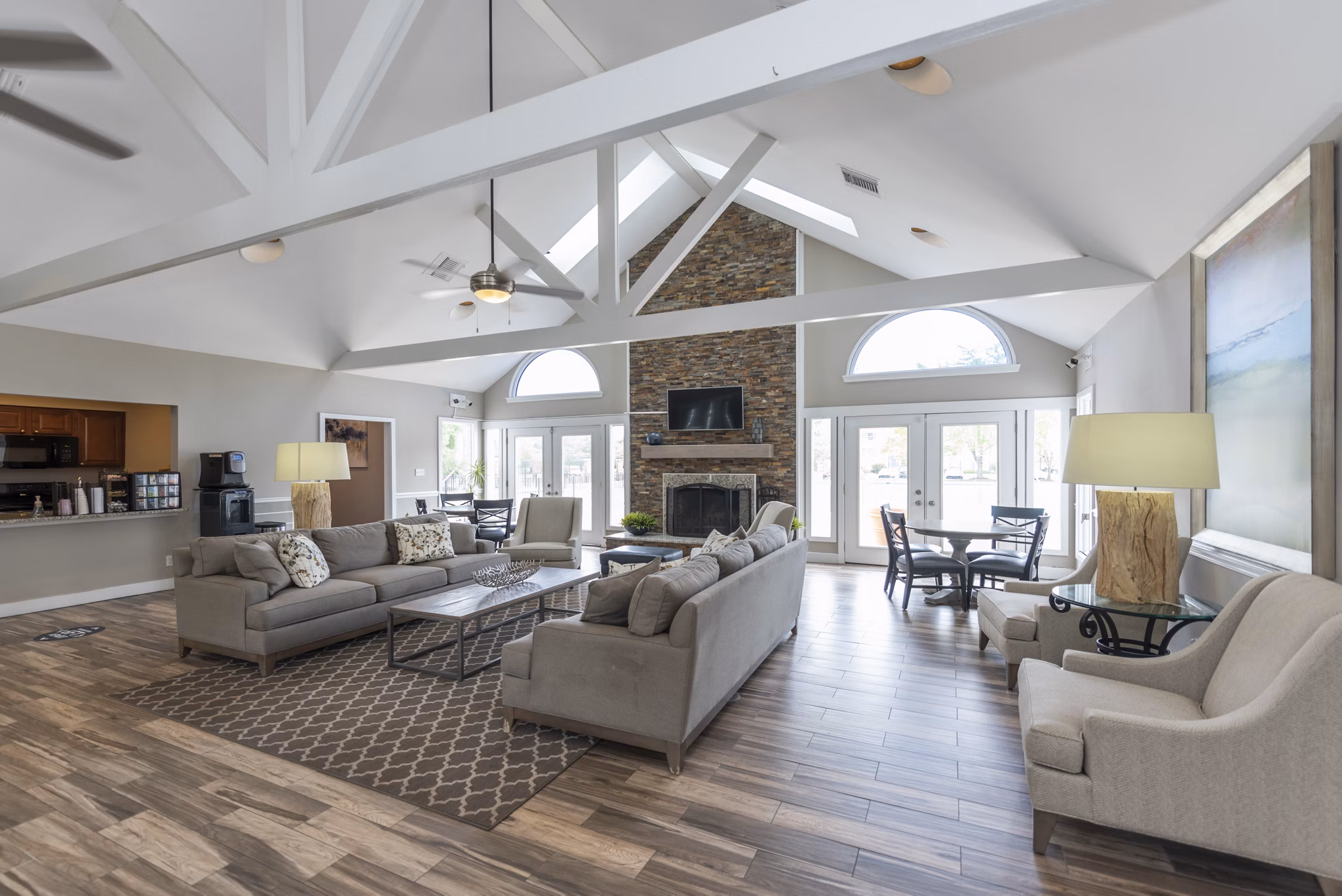 Elegant clubhouse with comfortable seating at Avana Fieldstone Apartments, offering a luxurious community space for socializing and events
