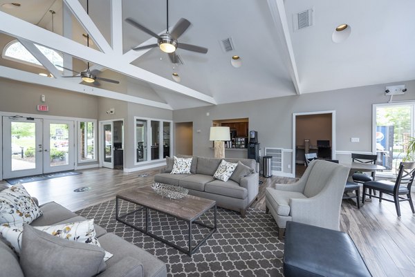 Elegant clubhouse with modern seating and lighting at Avana Fieldstone Apartments, ideal for social gatherings and events