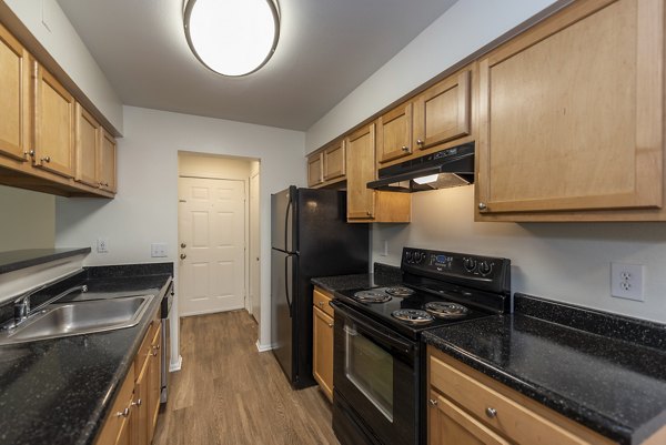 Modern kitchen with stainless steel appliances at Avana Fieldstone Apartments