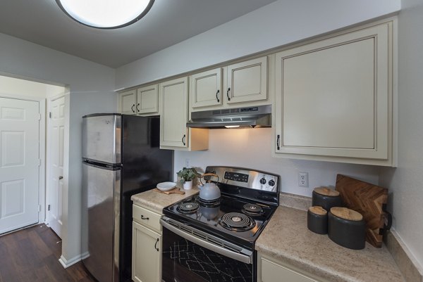 Modern kitchen featuring stainless steel appliances at Avana Fieldstone Apartments