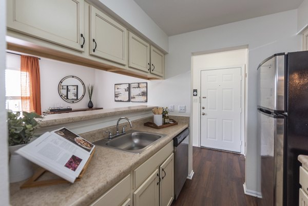 Modern kitchen with stainless steel appliances in Avana Fieldstone Apartments