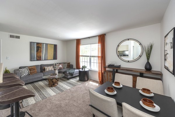 Cozy living room featuring plush sofa and modern decor at Avana Fieldstone Apartments
