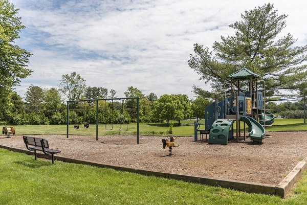 Modern playground with colorful equipment at Avana Fieldstone Apartments
