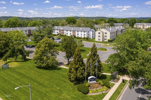 Scenic view of Avana Fieldstone Apartments: Lush green landscape and modern architecture