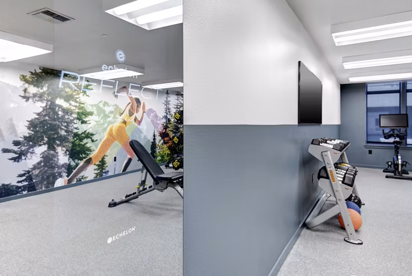 State-of-the-art fitness center with modern equipment at Hanna Heights Apartments in downtown Seattle