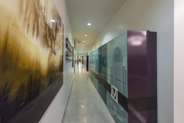 Clubhouse featuring modern design and seating at Millennium High Street Apartments