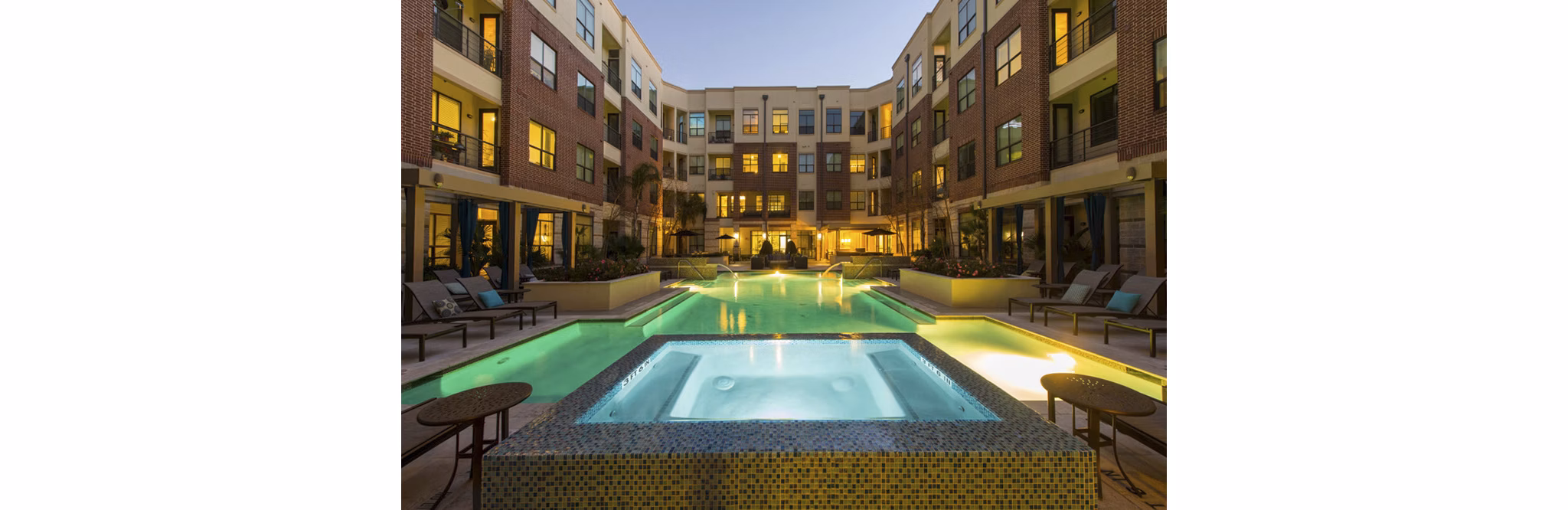 Rooftop pool with lounging area at Millennium High Street Apartments - luxury living in an urban oasis