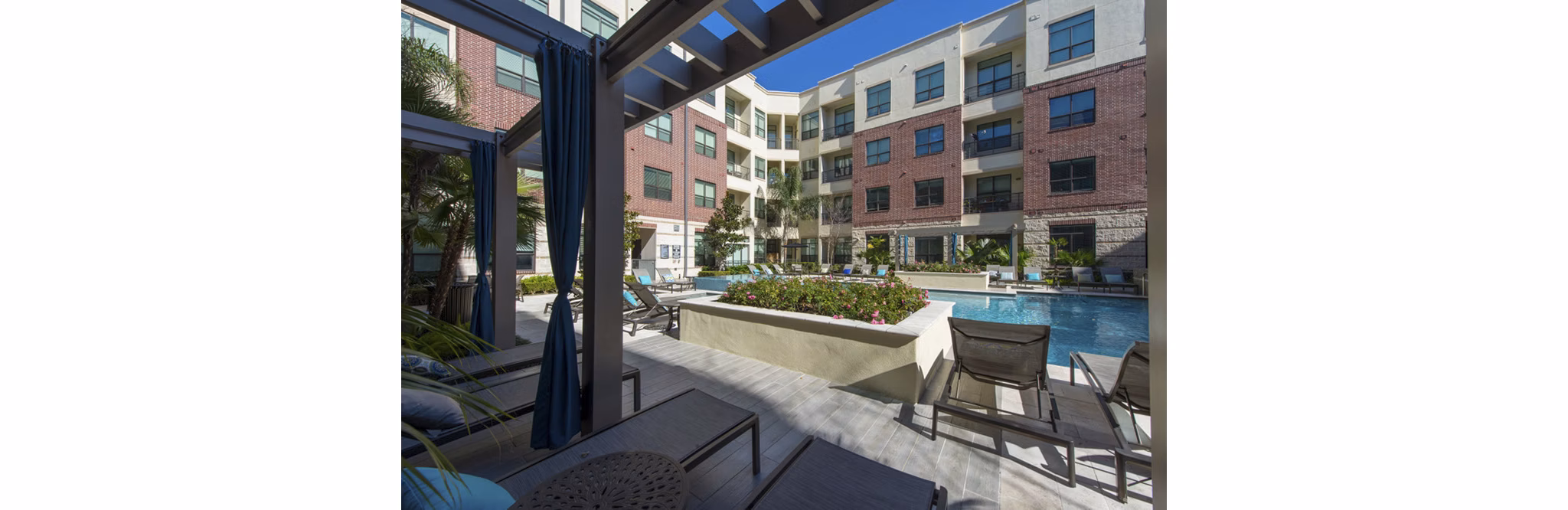 Spacious recreation room with lounge seating and billiards at Millennium High Street Apartments