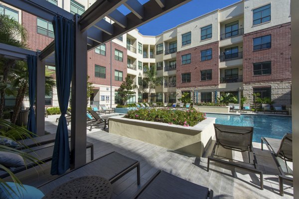 Spacious recreation room with lounge seating and billiards at Millennium High Street Apartments