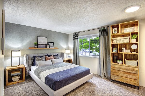 Bedroom featuring elegant bedding and modern decor in The Becket Apartments, luxury living in a vibrant community