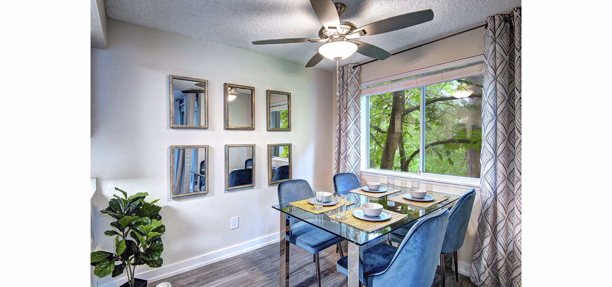 Dining area with modern furnishings and natural light at The Becket Apartments, luxury living space designed for comfortable gatherings