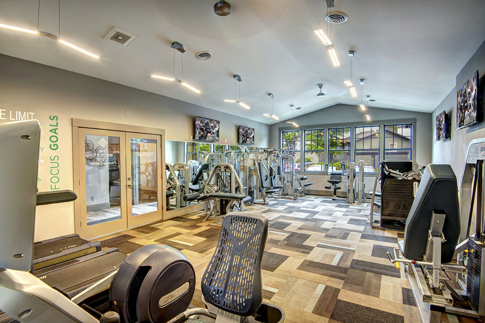 State-of-the-art fitness center at The Becket Apartments with modern exercise equipment