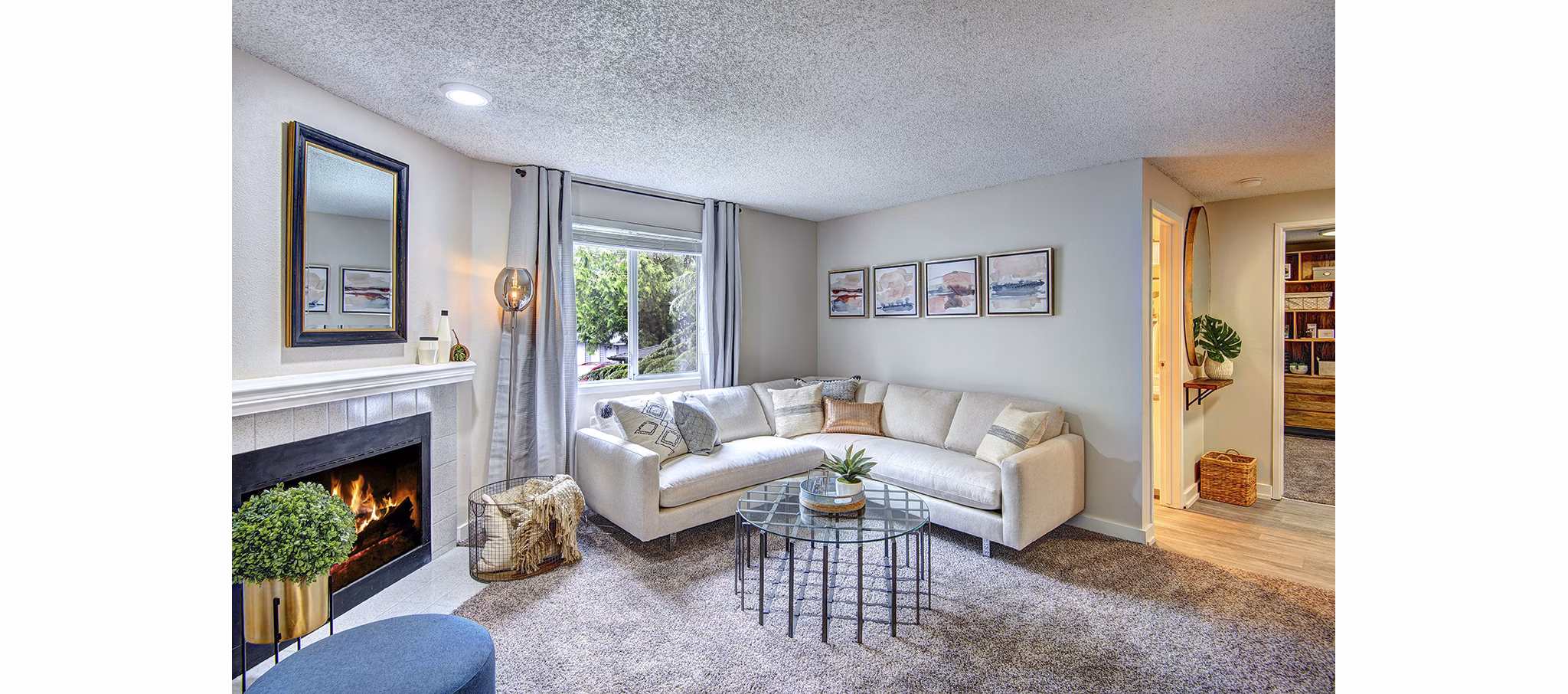 Spacious living room with modern furnishings in The Becket Apartments