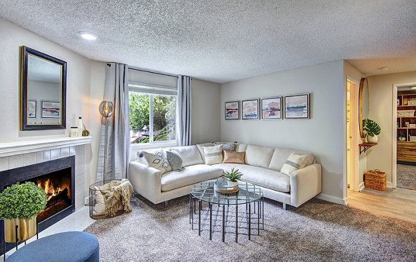 Spacious living room with modern furnishings in The Becket Apartments