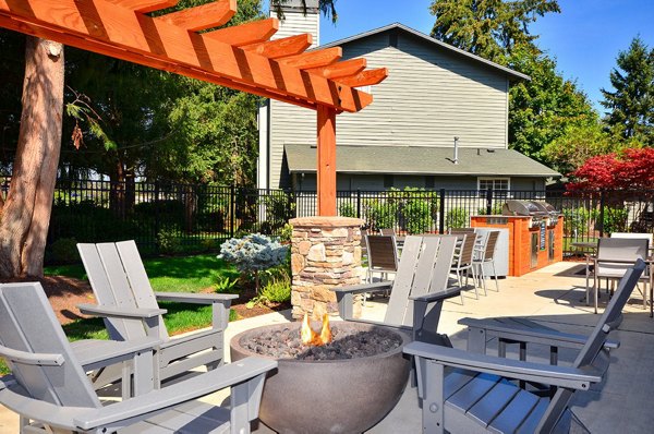 Relaxing evening around a modern fire pit at The Becket Apartments, a Greystar property offering luxury living with outdoor amenities