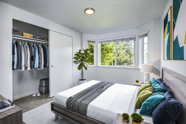 Bedroom featuring modern design and cozy ambiance at Smyth Apartments