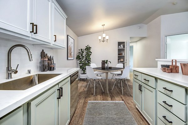 Dining room featuring elegant decor and modern lighting at Smyth Apartments