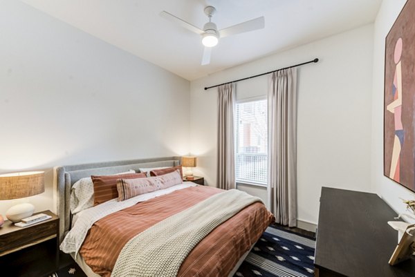 Modern bedroom with sleek furnishings at Encore Panther Island Apartments