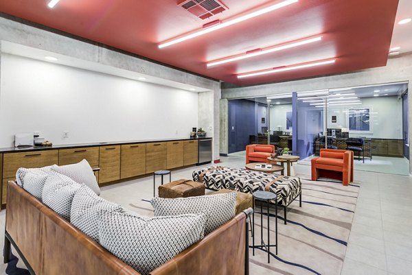 Clubhouse with modern design and cozy seating at Encore Panther Island Apartments