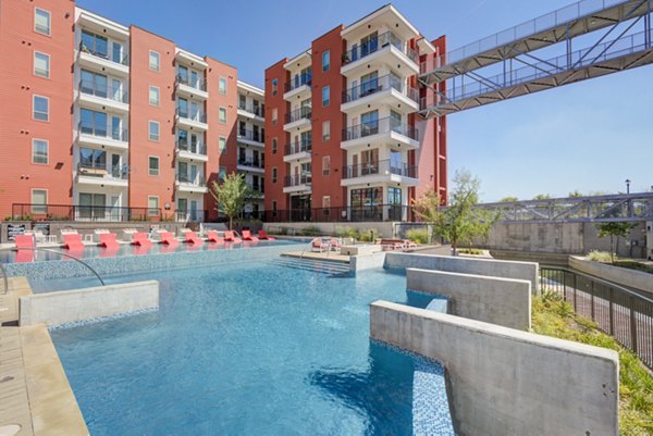 Rooftop pool with city views at Encore Panther Island Apartments in Fort Worth